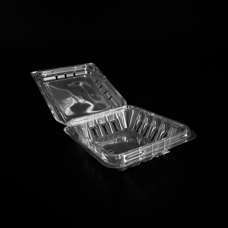 An open 4.4 ounce clear clamshell for blueberries.