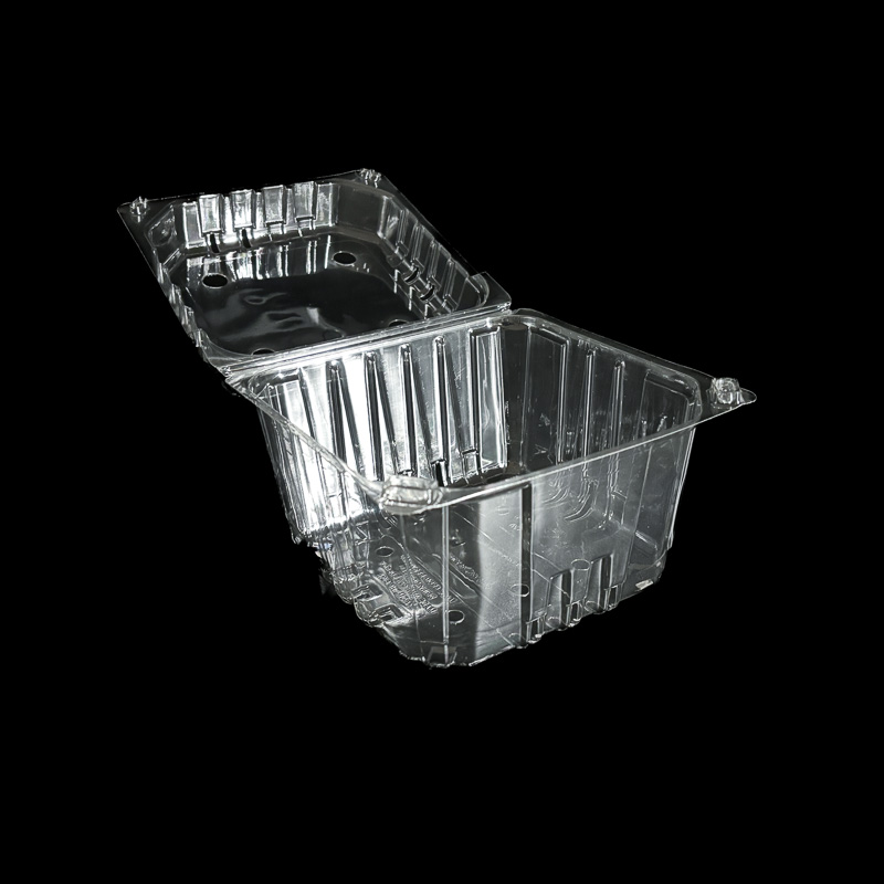 An open 4 pound clear clamshell for plums.