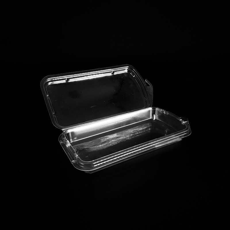 An open clear 2 ounce clamshell for herbs.