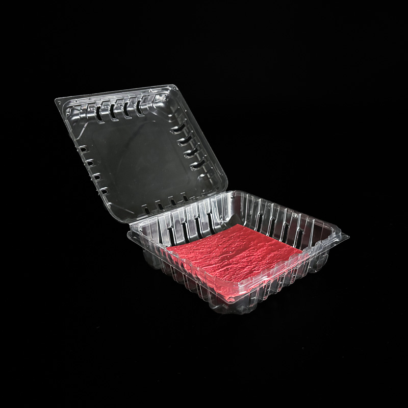 An open 6 ounce clear clamshell for raspberries.